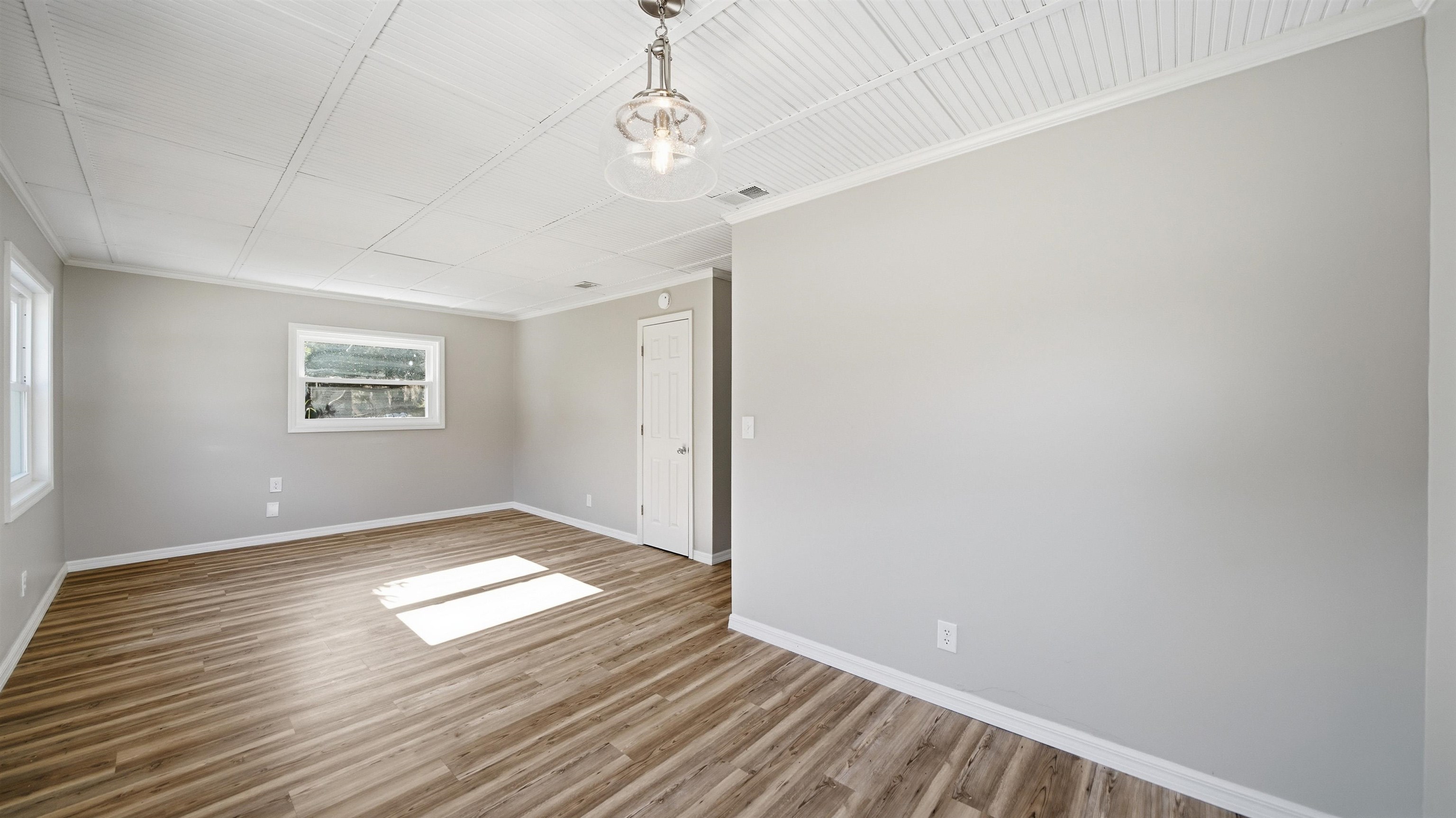 811 Hymon Circle Bunnell, FL 32110 - Photo 23 of 32 Unfurnished room with ornamental molding and wood finished floors