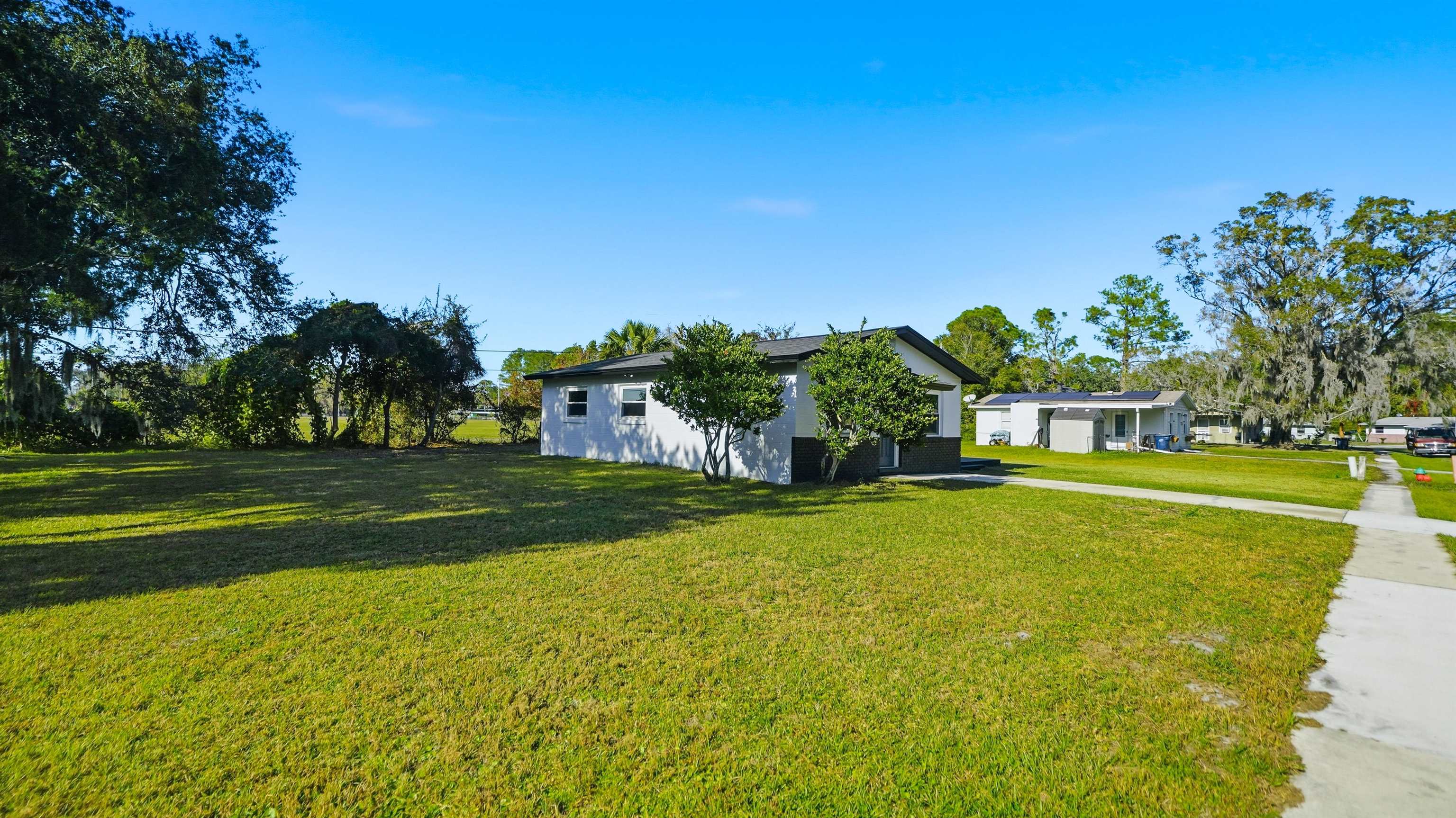 811 Hymon Circle Bunnell, FL 32110 - Photo 30 of 32 a front view of a house with a big yard