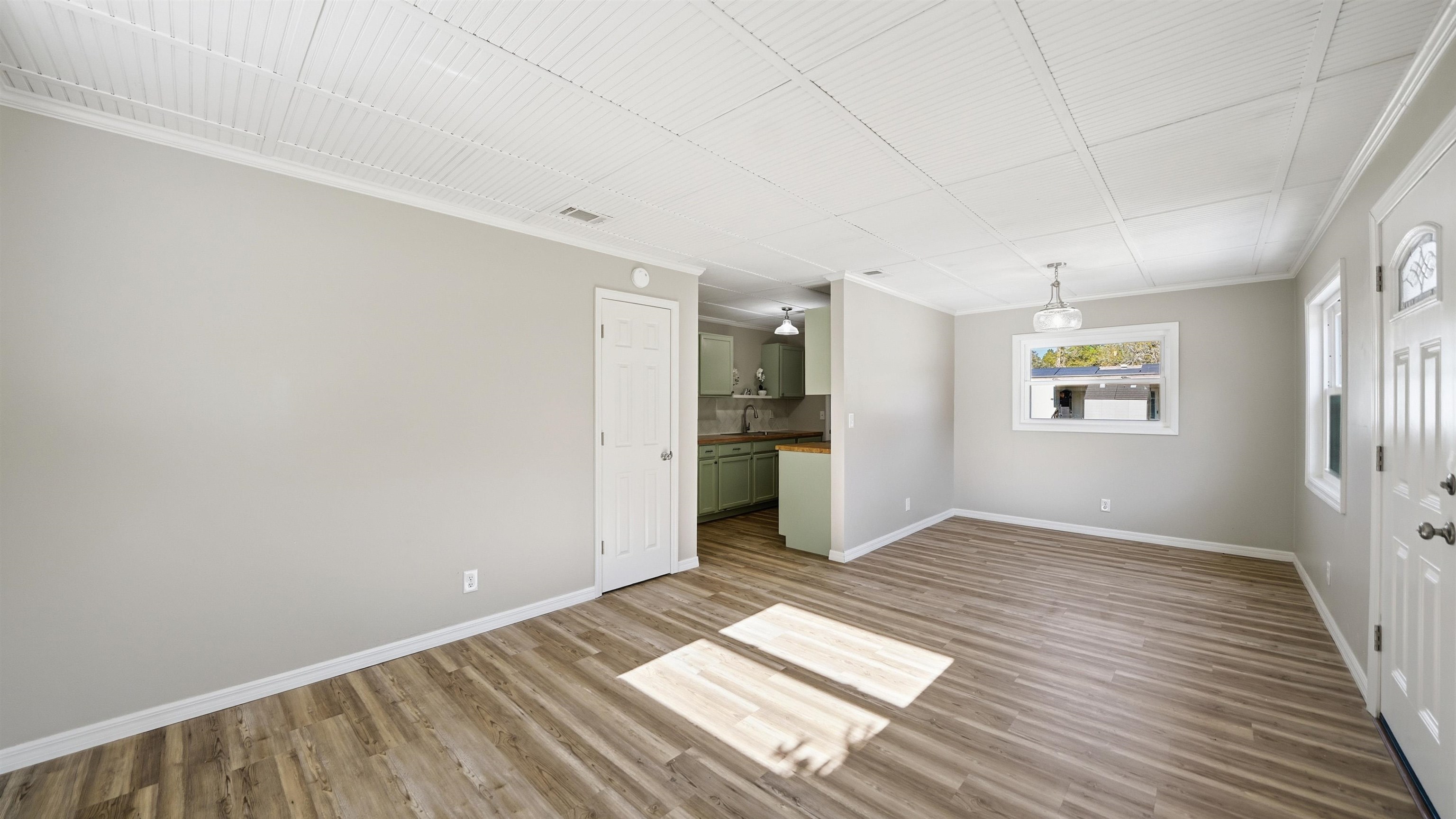 811 Hymon Circle Bunnell, FL 32110 - Photo 32 of 32 Spare room featuring crown molding and wood finished floors