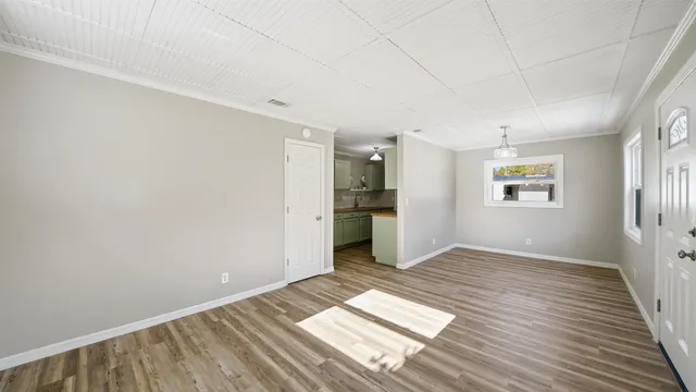 a view of wooden floor in an empty room