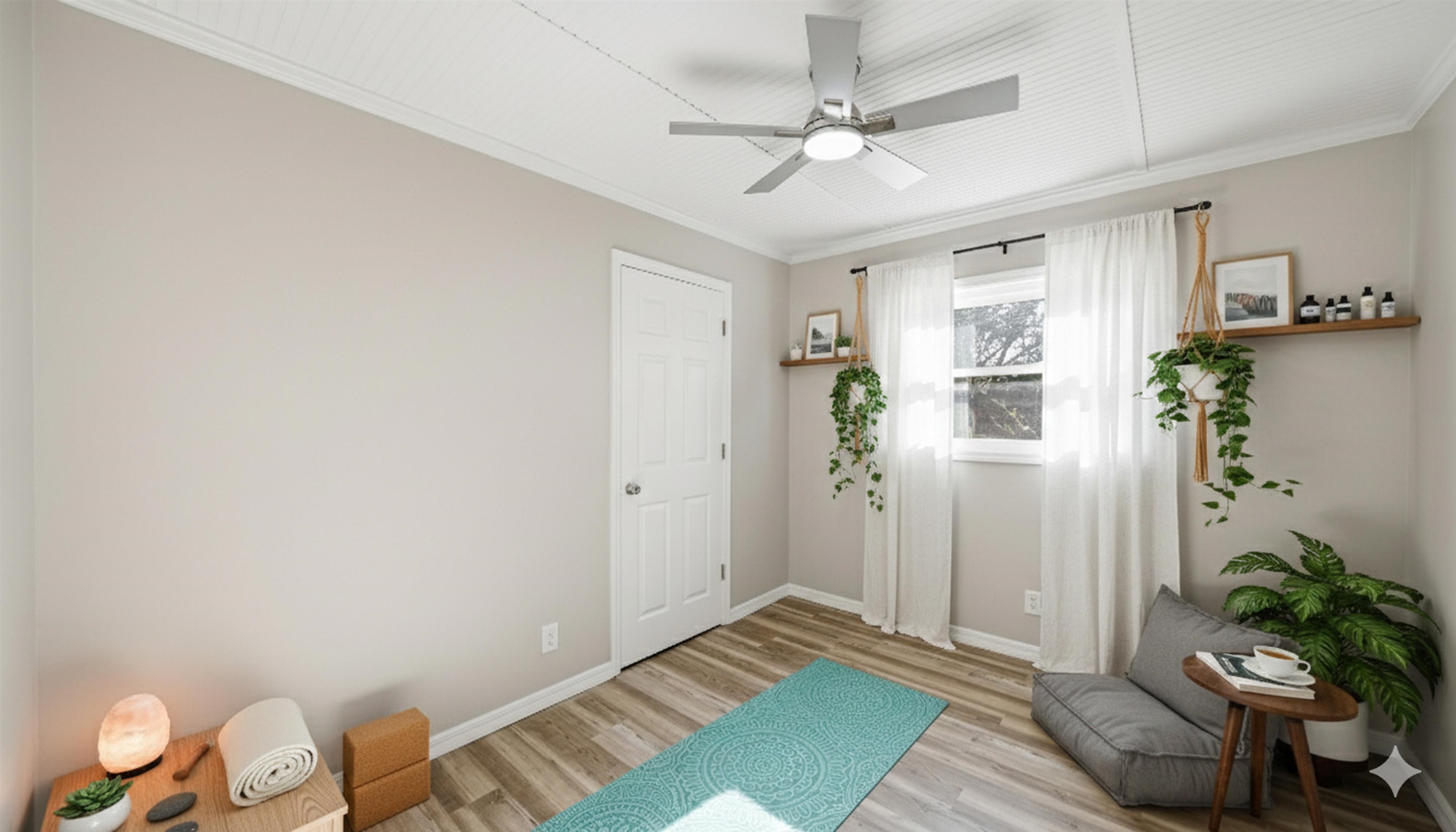 811 Hymon Circle Bunnell, FL 32110 - Photo 8 of 32 Sitting room with crown molding, light wood finished floors, and a ceiling fan