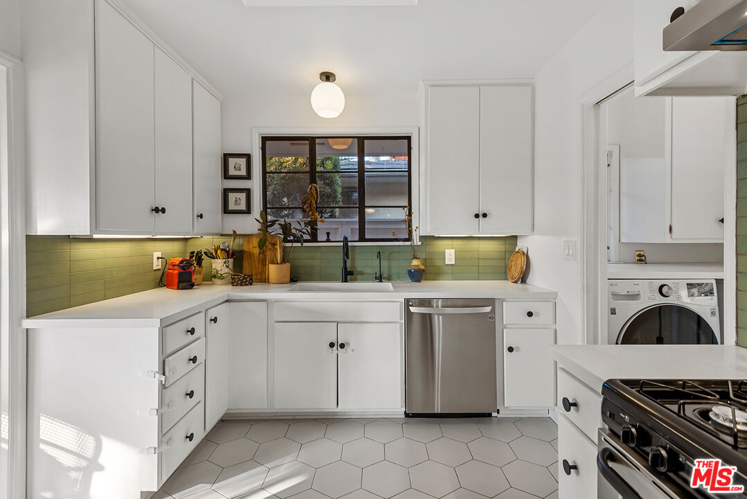356 Cherry Drive Pasadena, CA 91105 - Photo 11 of 23 a kitchen with white cabinets and appliances