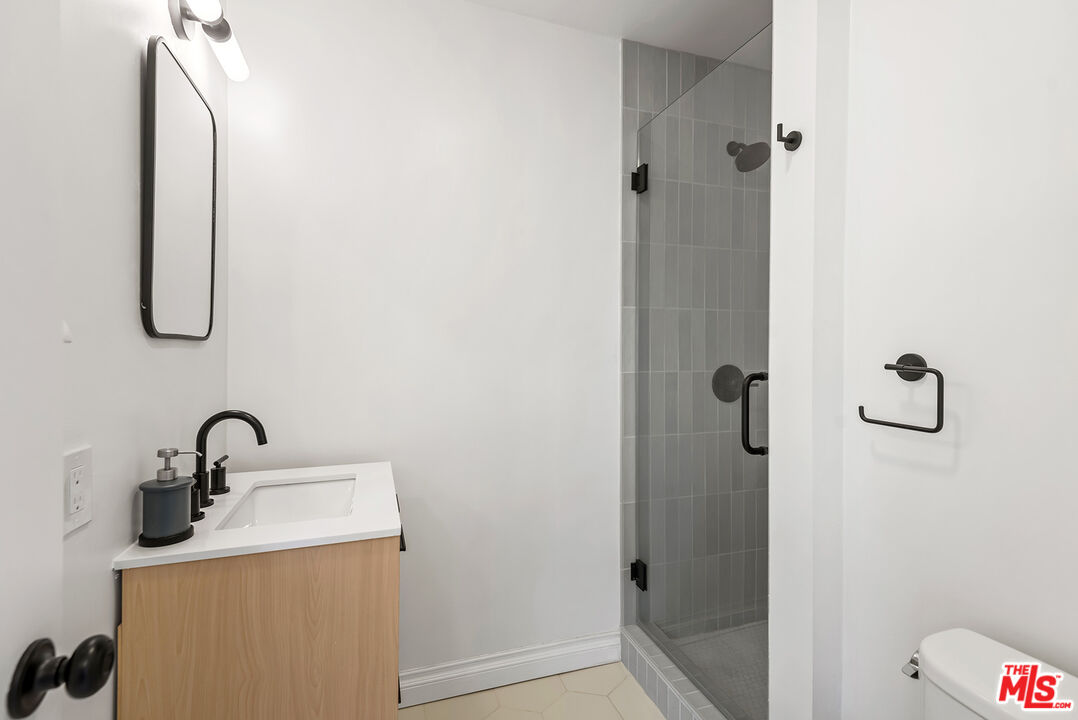 356 Cherry Drive Pasadena, CA 91105 - Photo 14 of 23 a bathroom with a sink and mirror