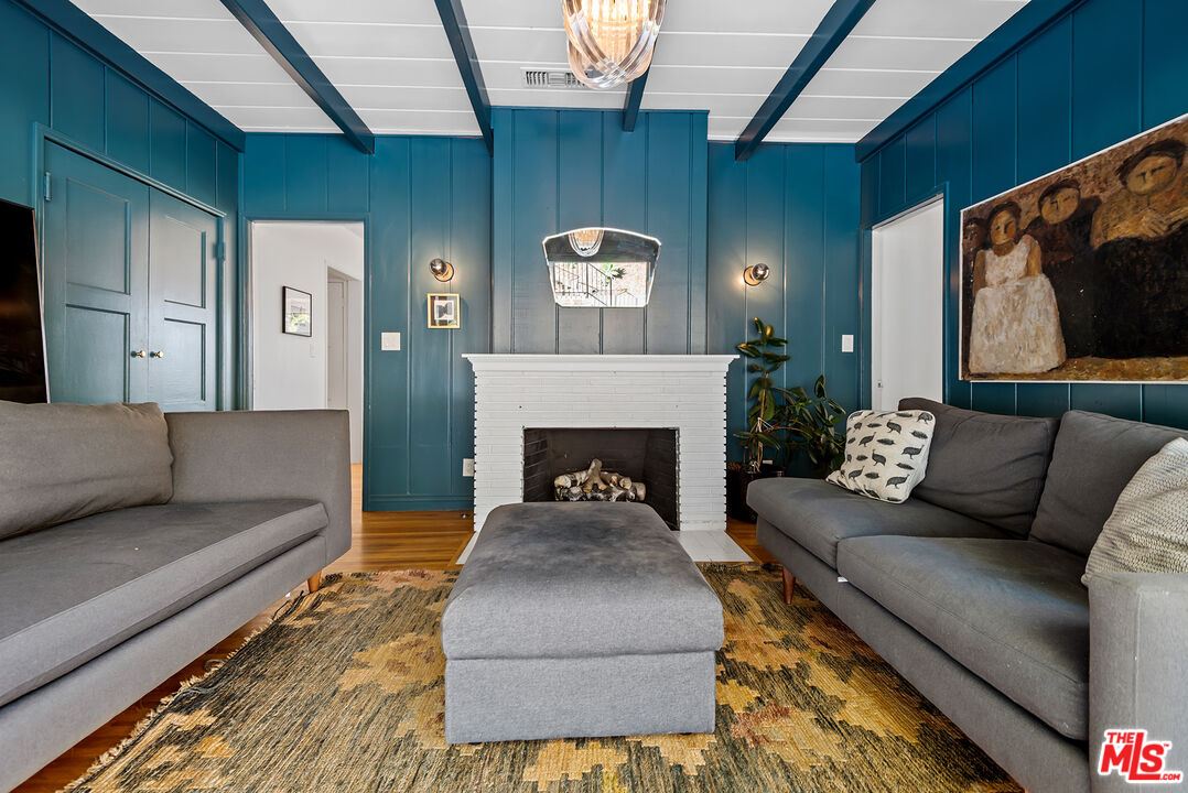 356 Cherry Drive Pasadena, CA 91105 - Photo 15 of 23 a living room with furniture and a fireplace