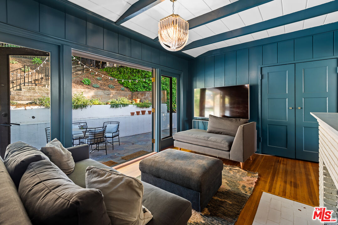356 Cherry Drive Pasadena, CA 91105 - Photo 17 of 23 a living room with furniture a ceiling fan and a large window