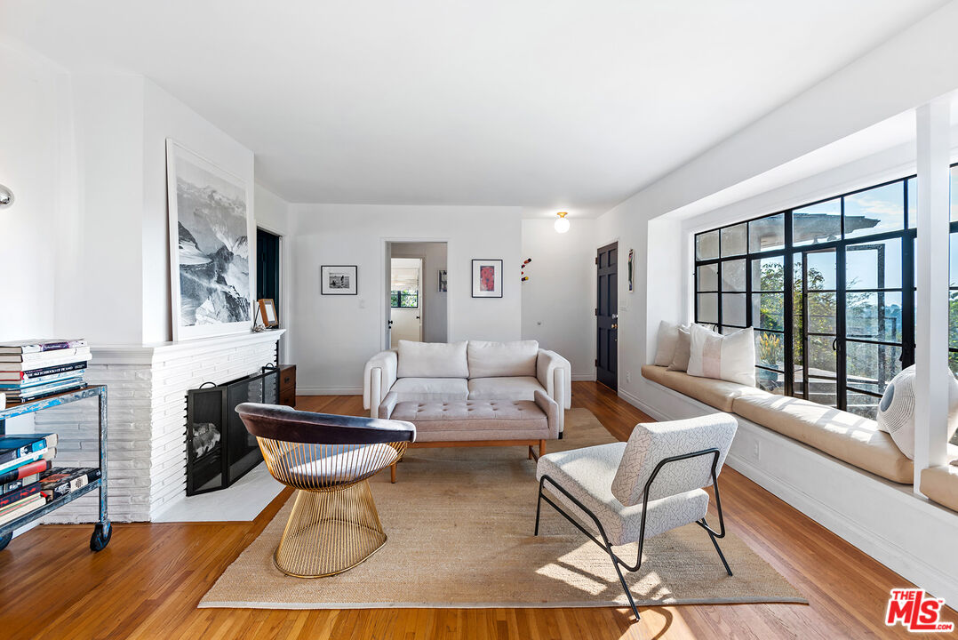 356 Cherry Drive Pasadena, CA 91105 - Photo 4 of 23 a living room with furniture a table and a large window