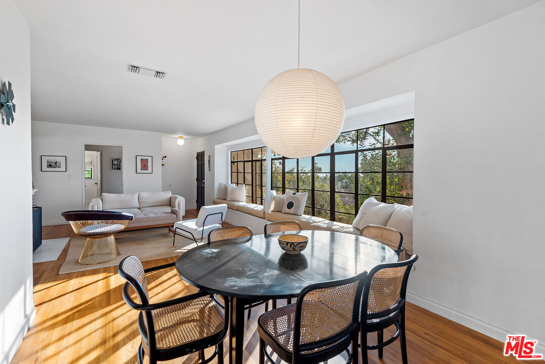 356 Cherry Drive Pasadena, CA 91105 - Photo 7 of 23 a view of a dining room with furniture window and wooden floor