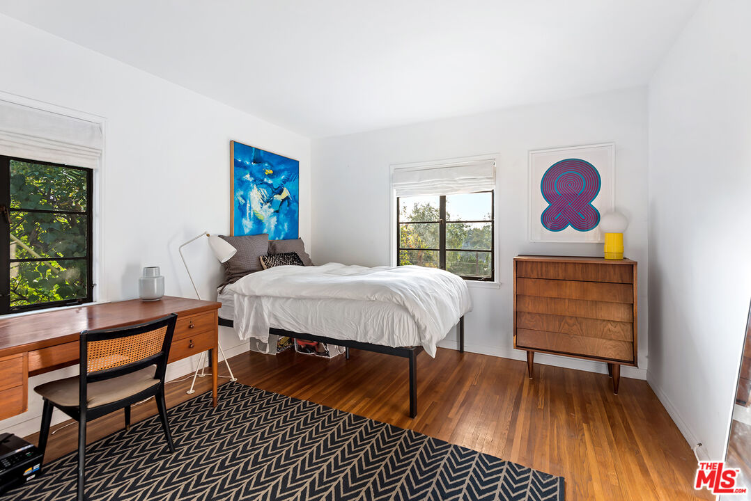 356 Cherry Drive Pasadena, CA 91105 - Photo 8 of 23 a bedroom with a bed and wooden floor