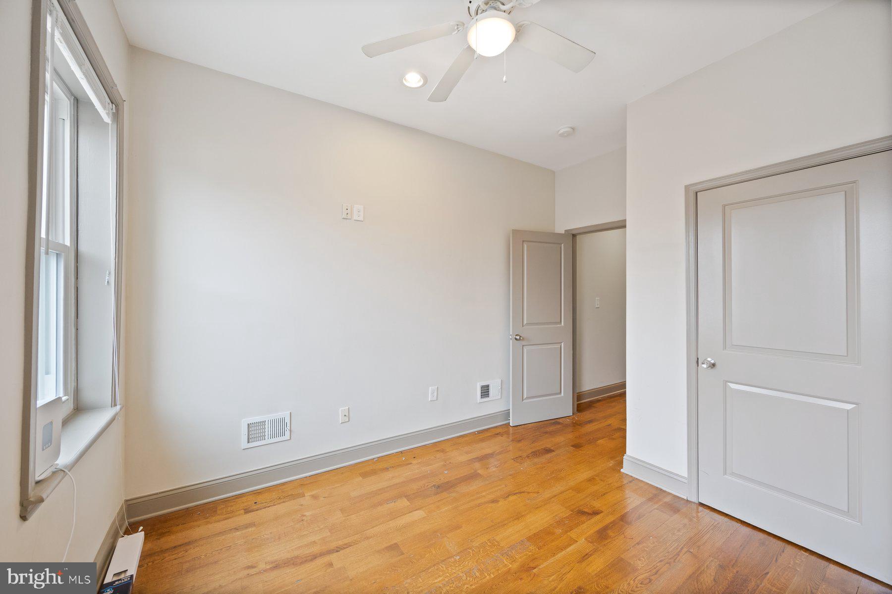 2209 Mullikin Street Baltimore, MD 21231 - Photo 20 of 32 an empty room with windows