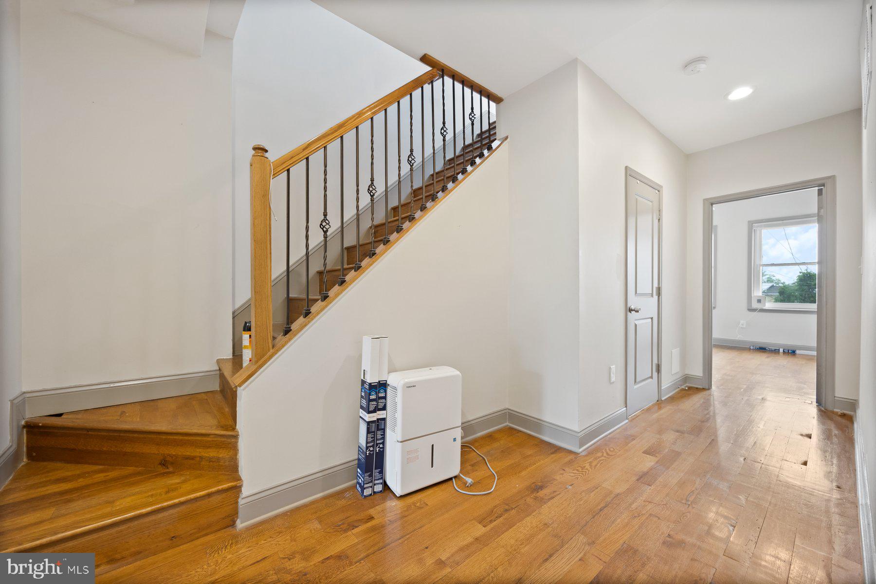 2209 Mullikin Street Baltimore, MD 21231 - Photo 21 of 32 a view of entryway and hall with wooden floor