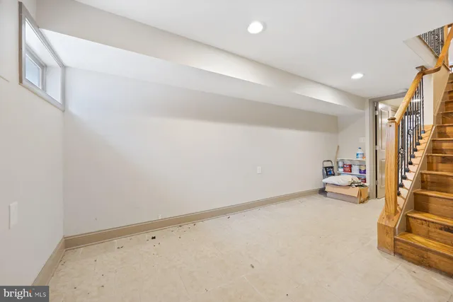 a white toilet sitting next to a bathroom sink