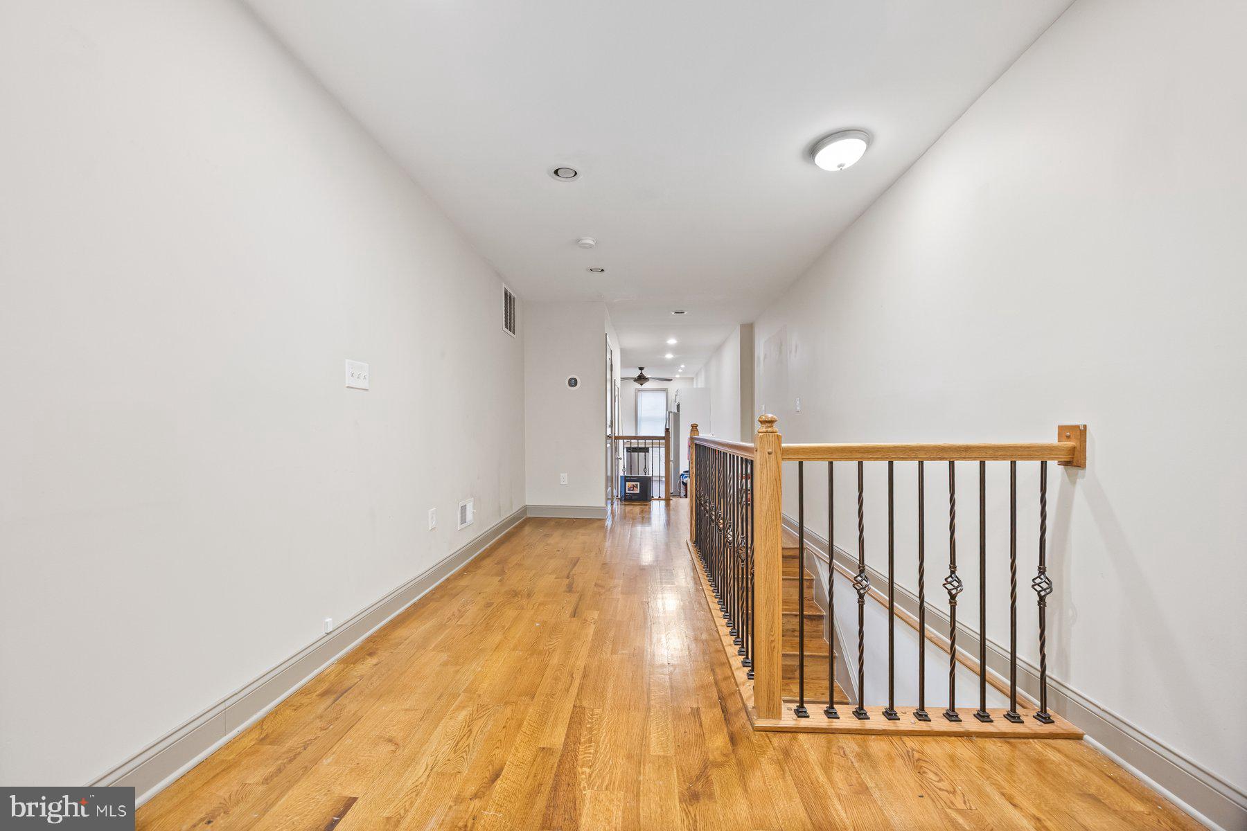 2209 Mullikin Street Baltimore, MD 21231 - Photo 3 of 32 a view of a room with wooden floor