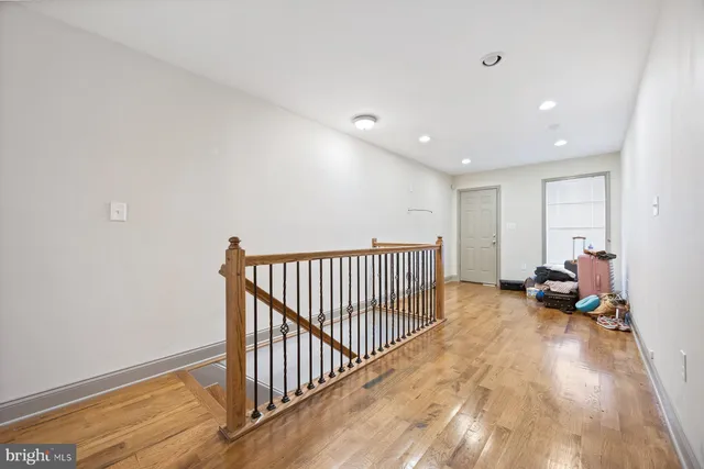 a view of a hallway with livingroom and bedroom