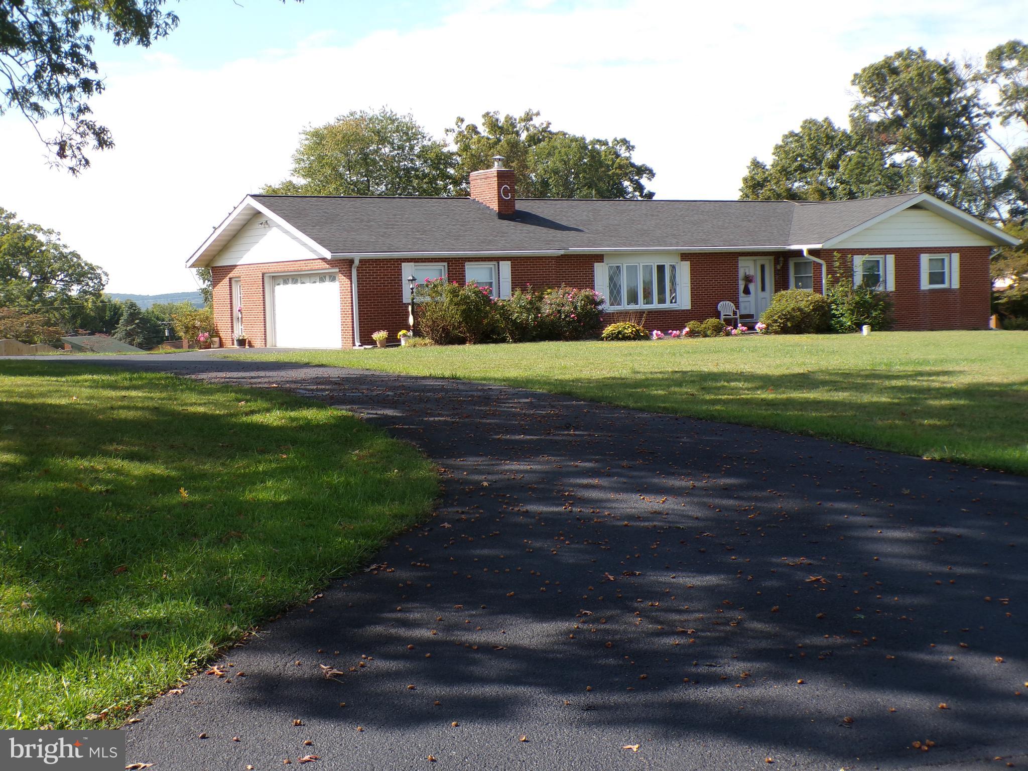 2713 Rowe Road New Windsor, MD 21776 - Photo 1 of 67 a front view of a house with a yard
