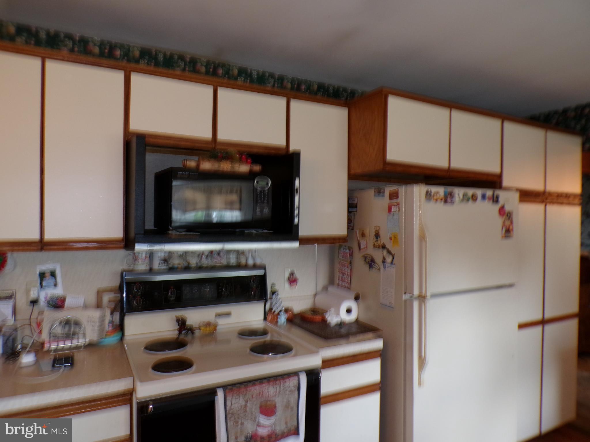 2713 Rowe Road New Windsor, MD 21776 - Photo 11 of 67 a kitchen with stainless steel appliances a stove a refrigerator and a sink