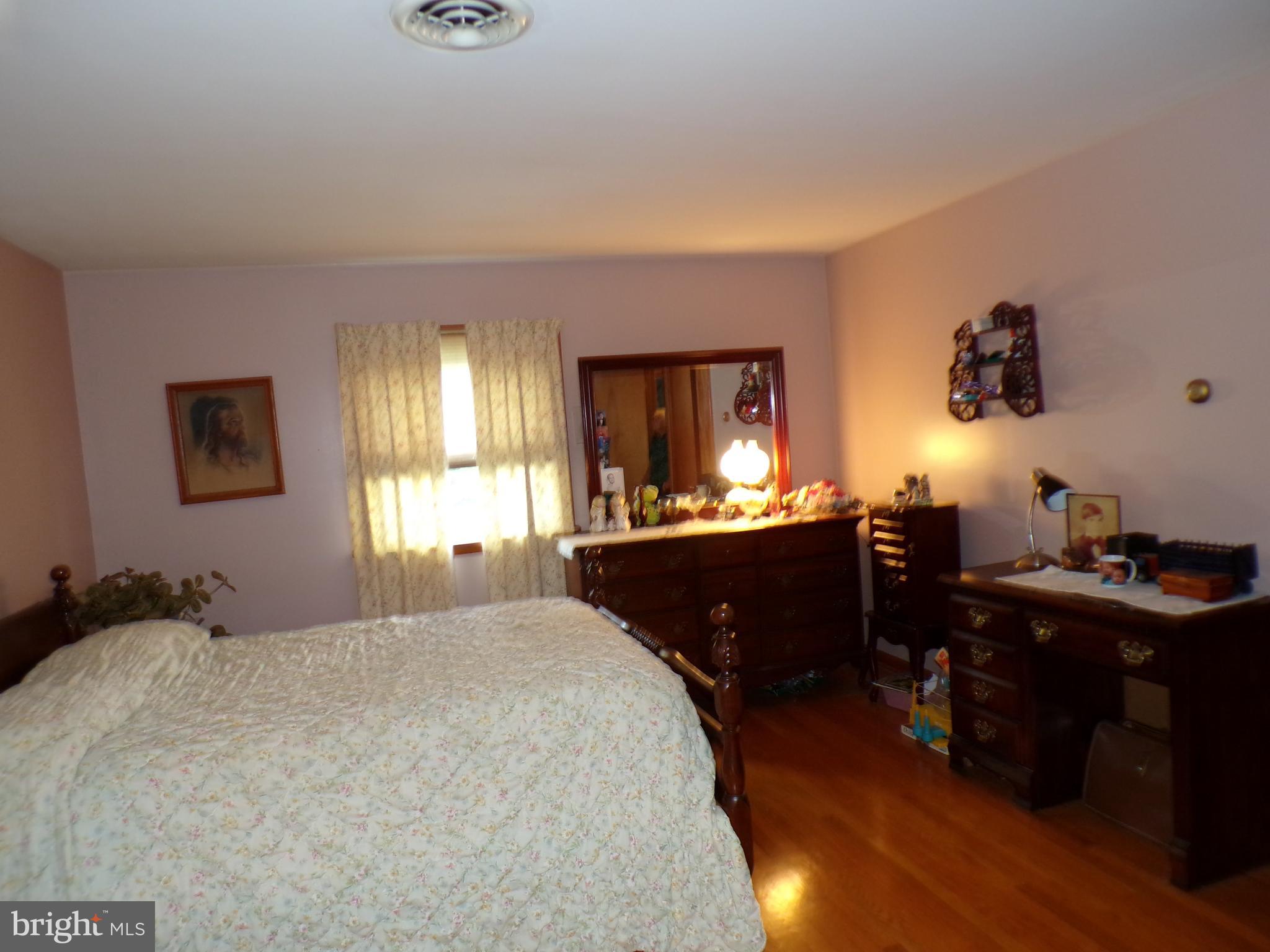 2713 Rowe Road New Windsor, MD 21776 - Photo 17 of 67 a bedroom with a bed and a dresser