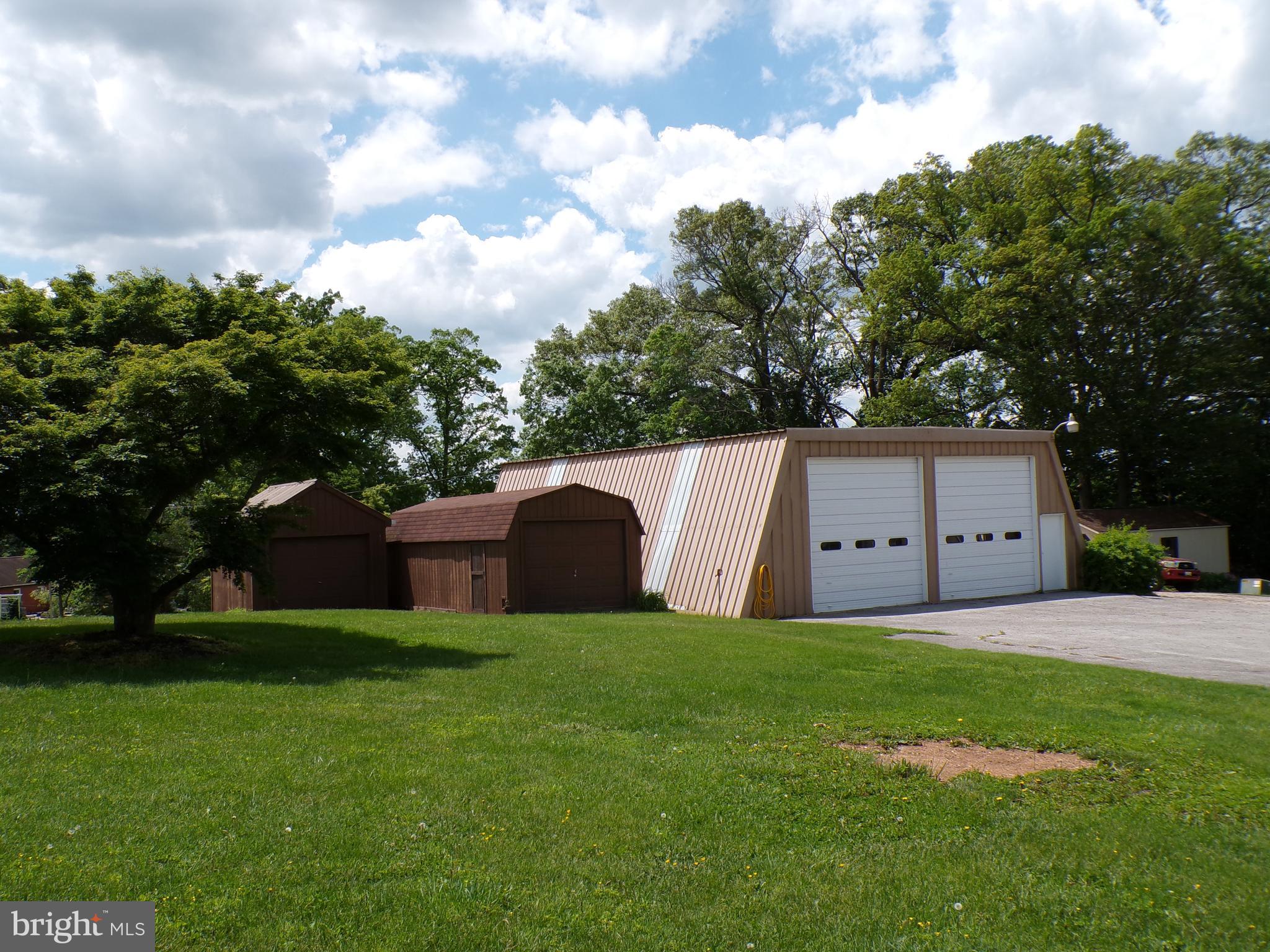 2713 Rowe Road New Windsor, MD 21776 - Photo 2 of 67 a view of a tiny house with a yard