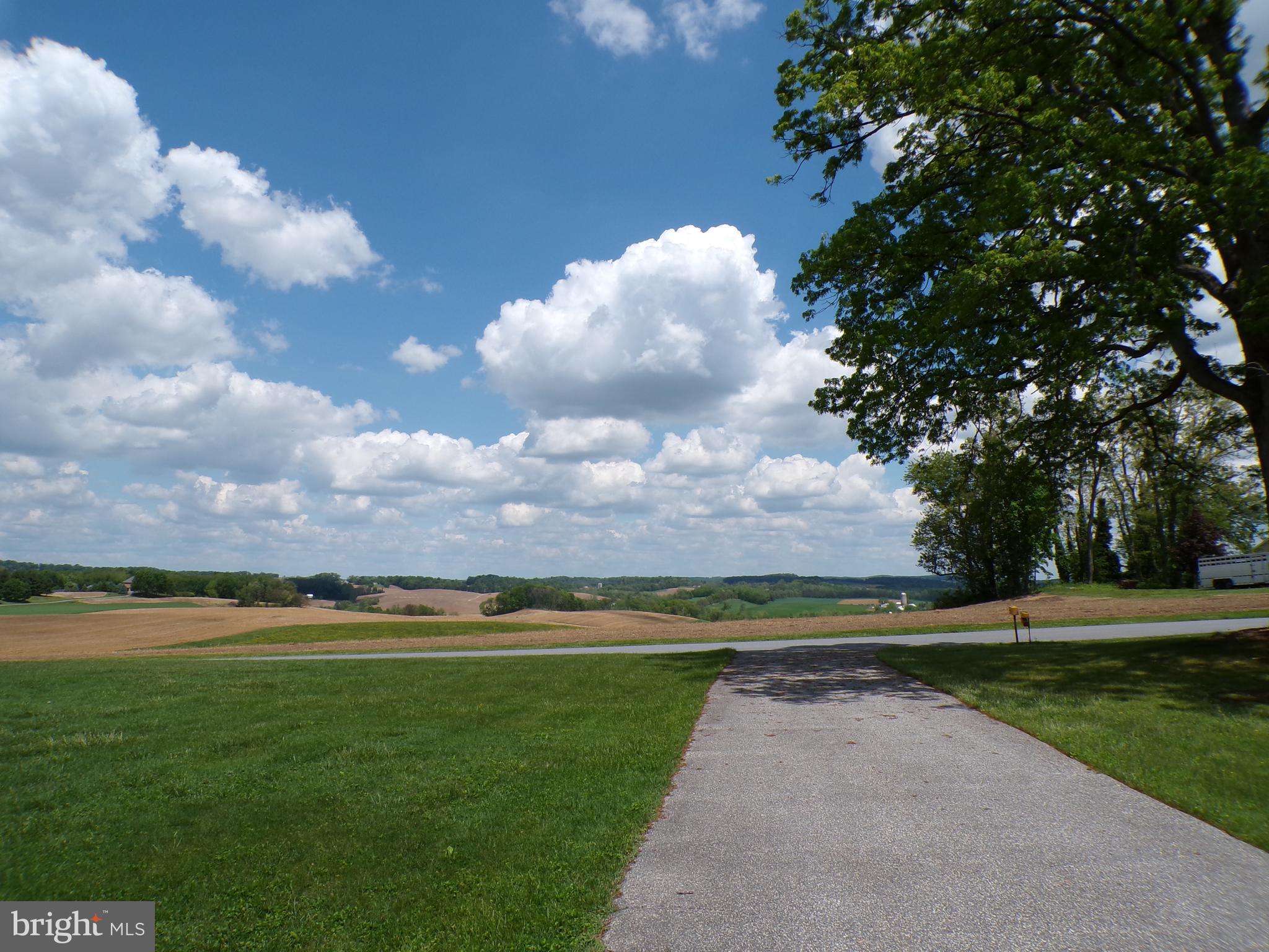 2713 Rowe Road New Windsor, MD 21776 - Photo 25 of 67 a view of a golf course with a lake