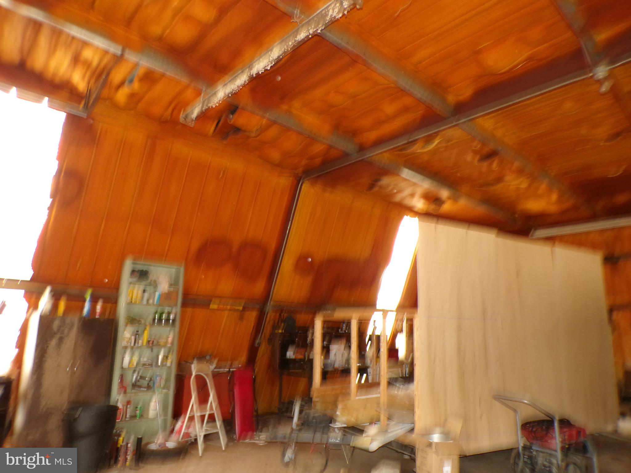 2713 Rowe Road New Windsor, MD 21776 - Photo 37 of 67 a view of walk in closet with clothes and shoes