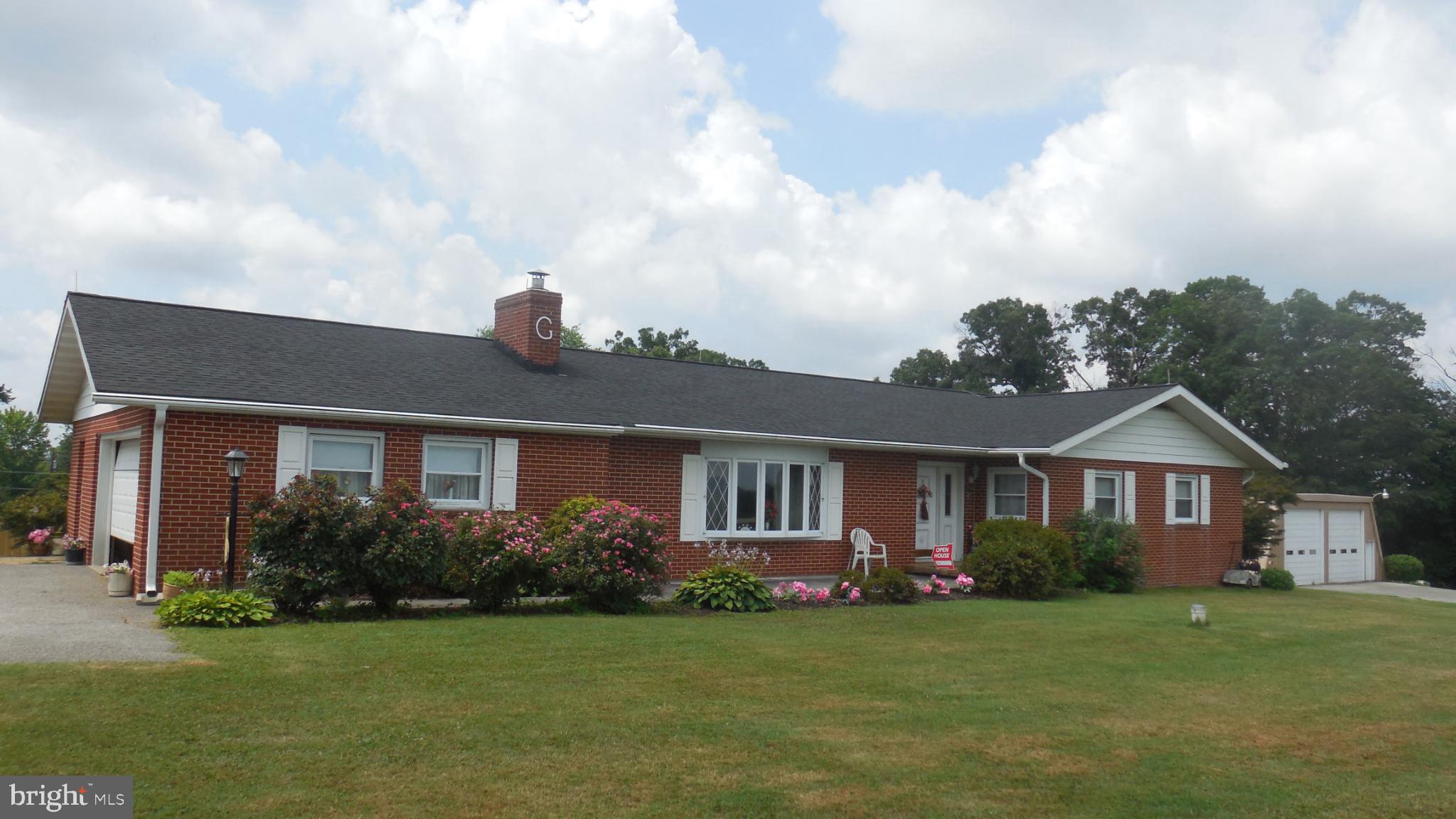 2713 Rowe Road New Windsor, MD 21776 - Photo 45 of 67 a front view of a house with garden