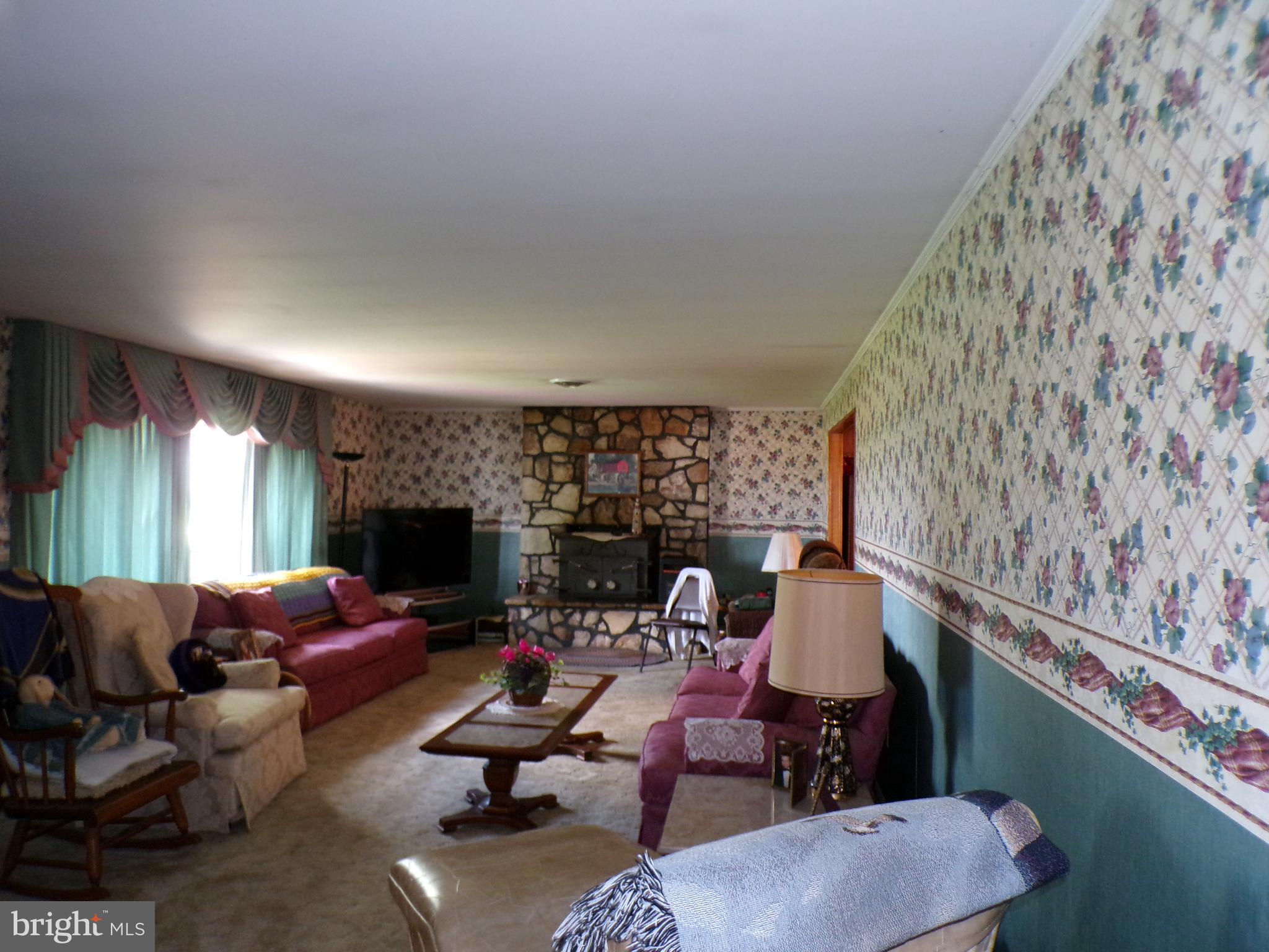 2713 Rowe Road New Windsor, MD 21776 - Photo 9 of 67 a living room with furniture and a flat screen tv