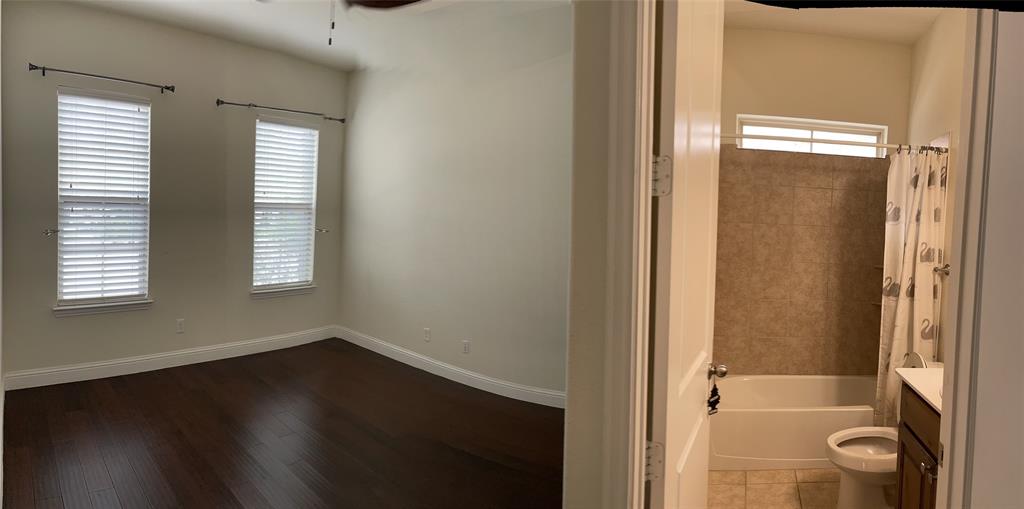 8031 Sunflower Lane Dallas, TX 75252 - Photo 17 of 34 a view of a bathroom with a glass door