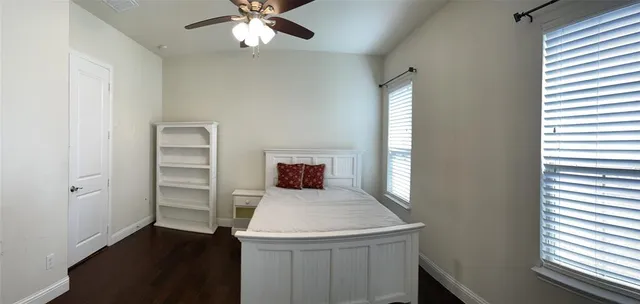 a bathroom with a tub shower sink and mirror