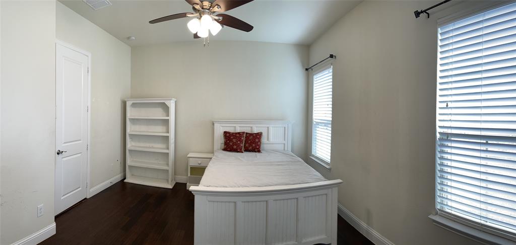 8031 Sunflower Lane Dallas, TX 75252 - Photo 20 of 34 wooden floor in an empty room with a window
