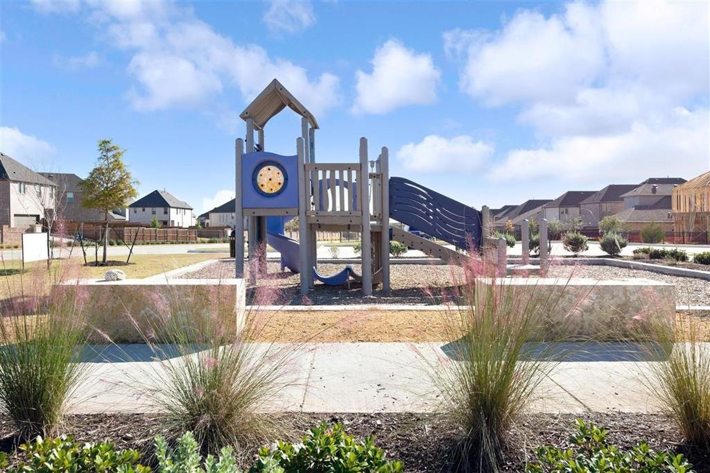 8031 Sunflower Lane Dallas, TX 75252 - Photo 5 of 34 a view of a street with brick building in front of it
