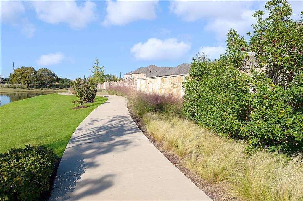 8031 Sunflower Lane Dallas, TX 75252 - Photo 7 of 34 a view of a lake with a yard
