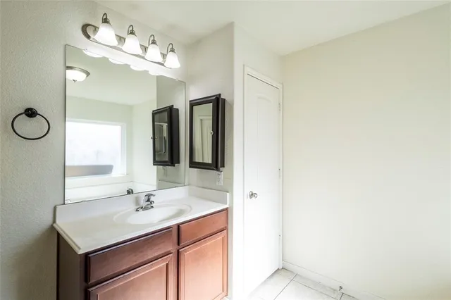 a bathroom with a tub and shower