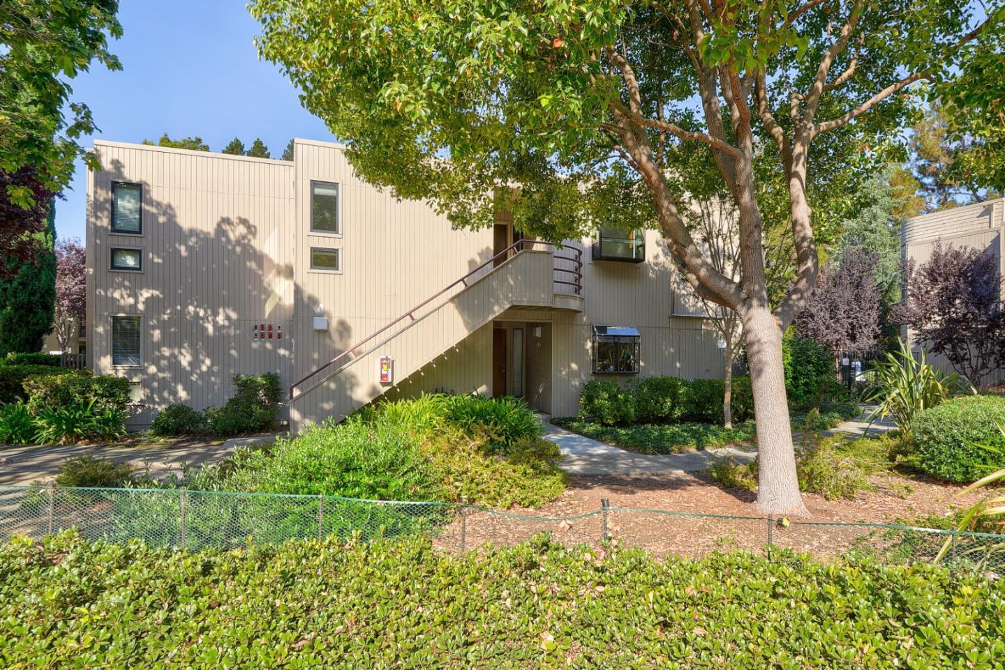 928 Wright Avenue, Unit 401 Mountain View, CA 94043 - Photo 2 of 18 a front view of a house with garden