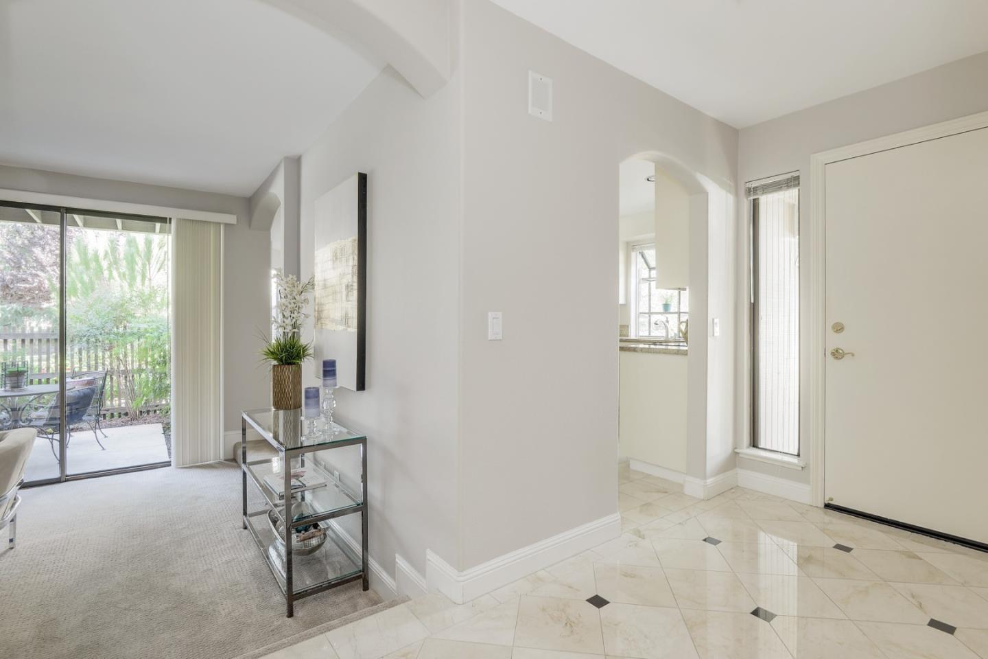 928 Wright Avenue, Unit 401 Mountain View, CA 94043 - Photo 12 of 18 a view of a livingroom with furniture and windows