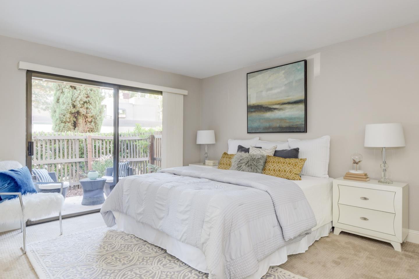 928 Wright Avenue, Unit 401 Mountain View, CA 94043 - Photo 15 of 18 a bedroom with a bed and a large window