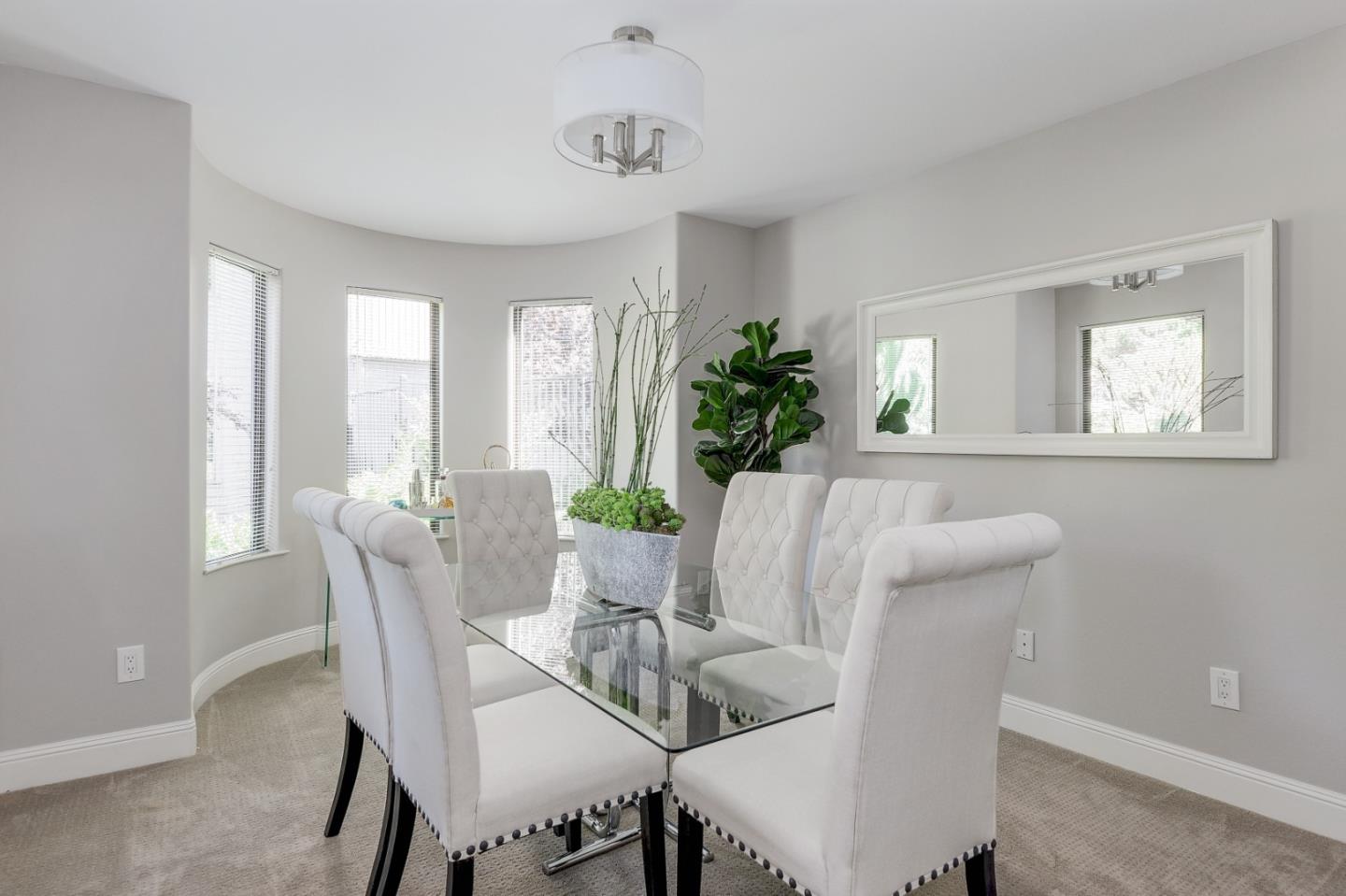 928 Wright Avenue, Unit 401 Mountain View, CA 94043 - Photo 6 of 18 a view of a dining room with furniture window and wooden floor