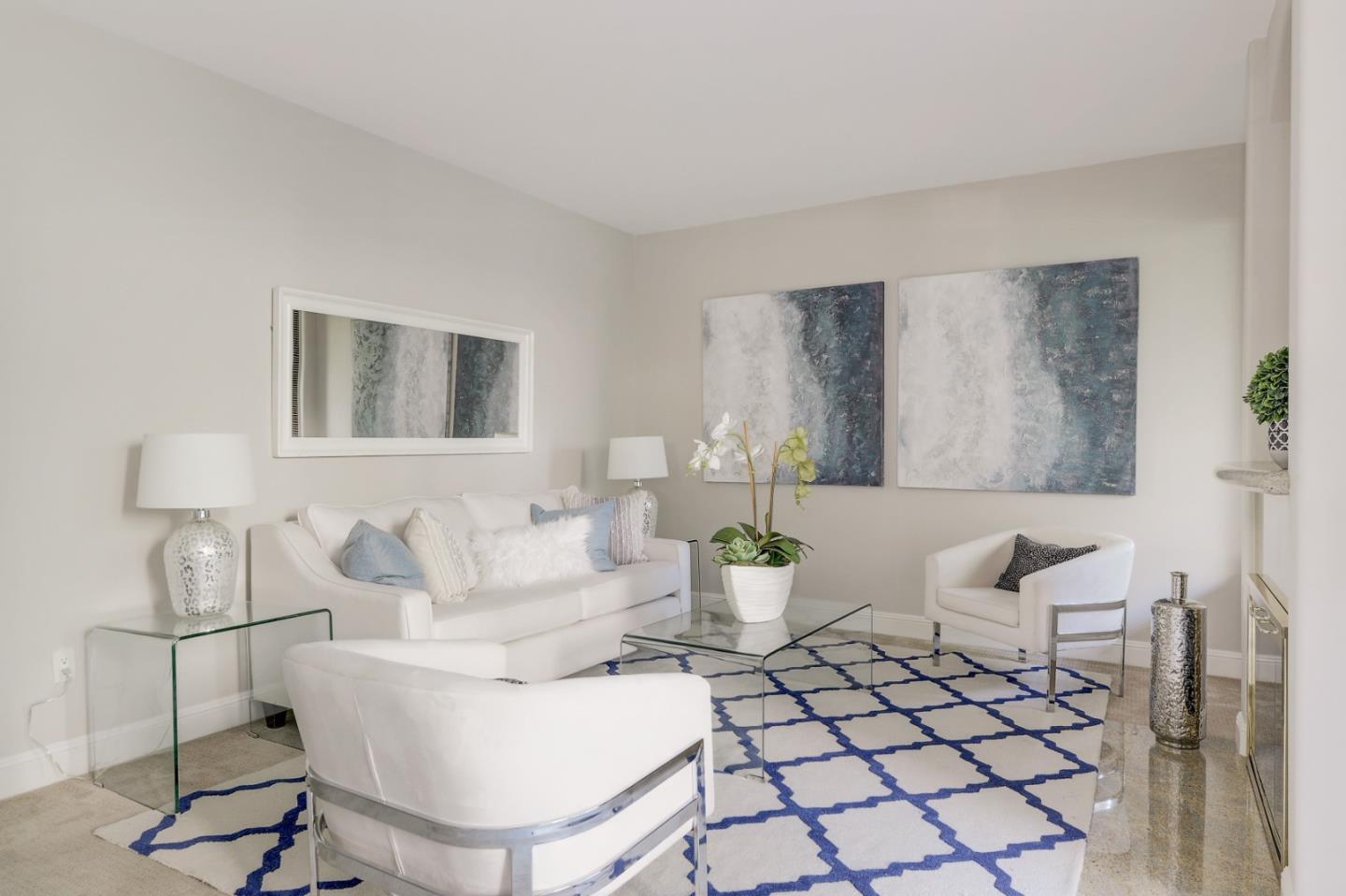 928 Wright Avenue, Unit 401 Mountain View, CA 94043 - Photo 8 of 18 a living room with furniture a table and chair