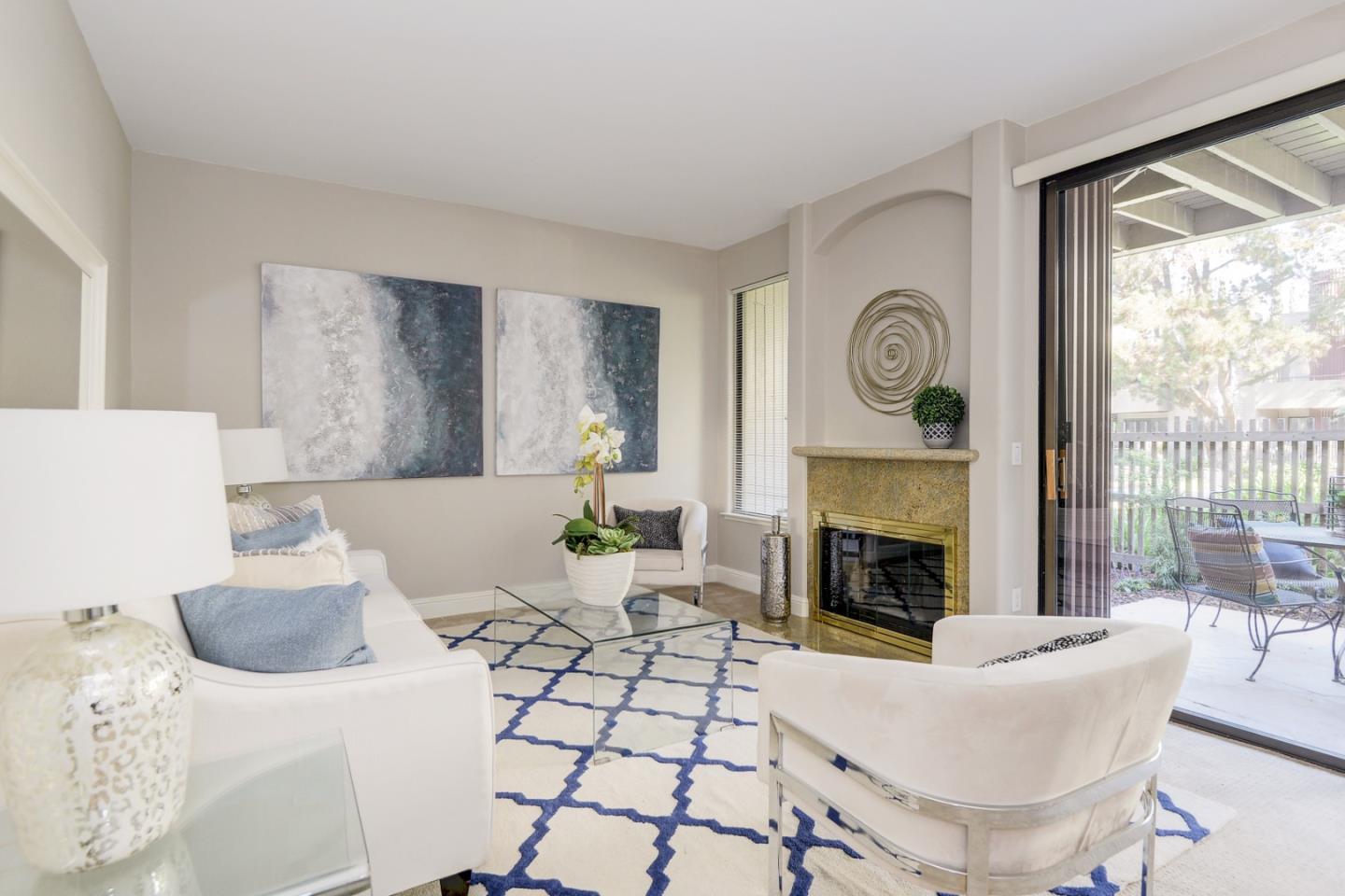 928 Wright Avenue, Unit 401 Mountain View, CA 94043 - Photo 9 of 18 a living room with furniture and a fireplace