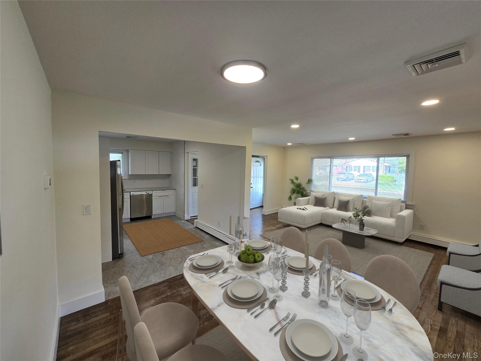 90 Blue Point Road Selden, NY 11784 - Photo 7 of 19 Spacious dining area featuring wood-finish flooring and a contemporary overhead light fixture