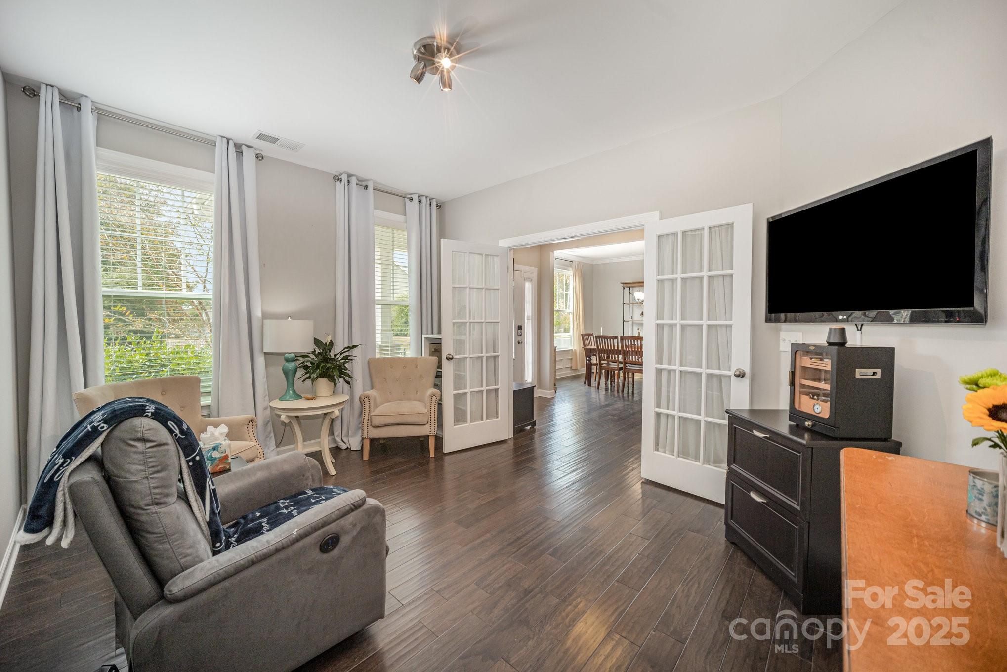 1556 Prickly Lane Waxhaw, NC 28173 - Photo 11 of 39 a living room with furniture and a flat screen tv