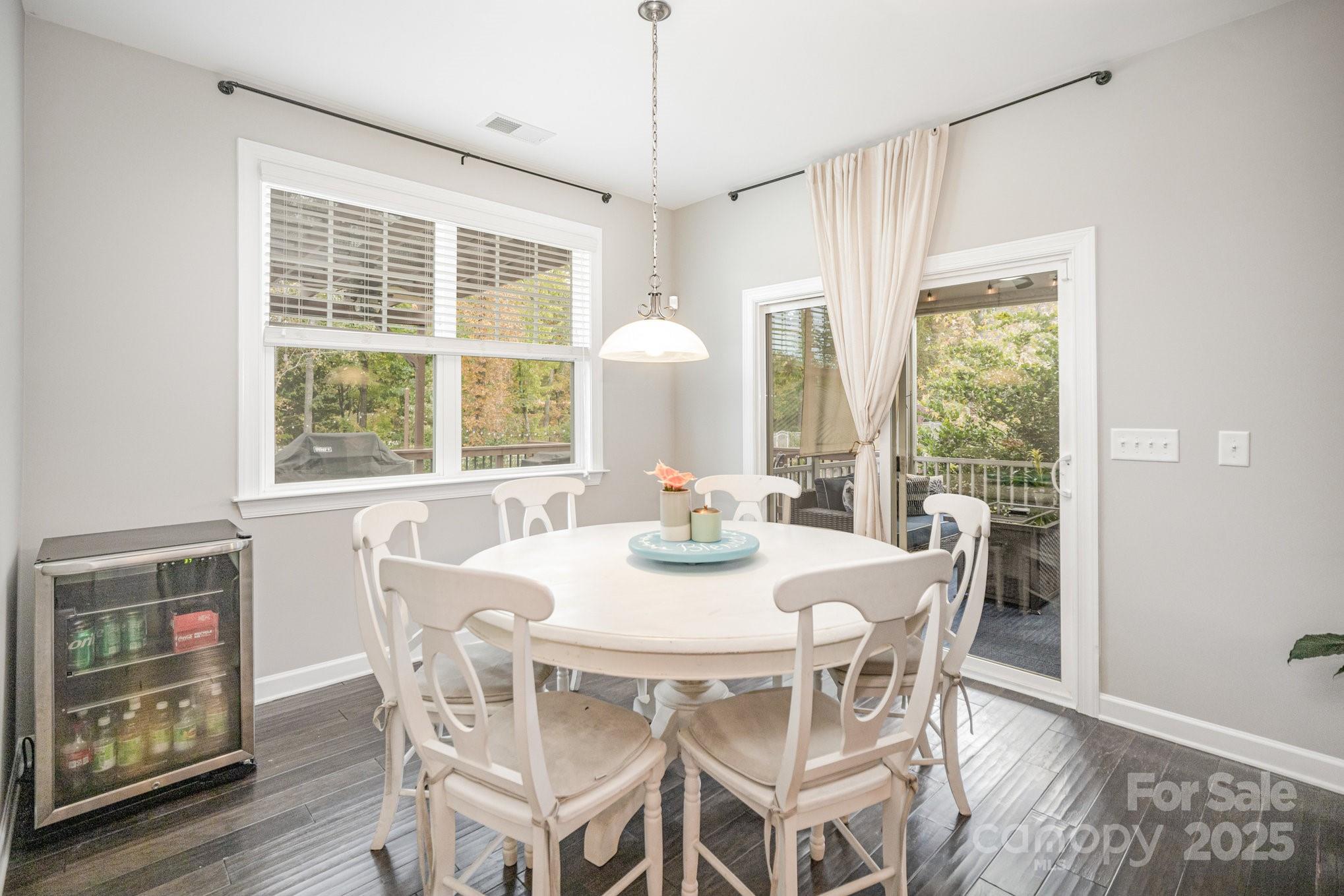 1556 Prickly Lane Waxhaw, NC 28173 - Photo 12 of 39 a view of a dining room with furniture window and wooden floor
