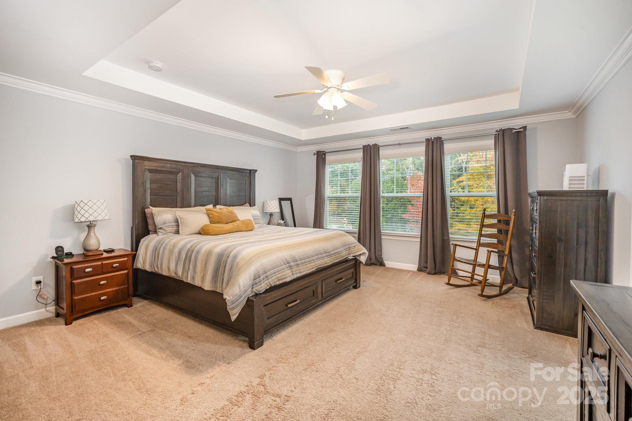 1556 Prickly Lane Waxhaw, NC 28173 - Photo 17 of 39 a bedroom with a large bed and flat tv screen