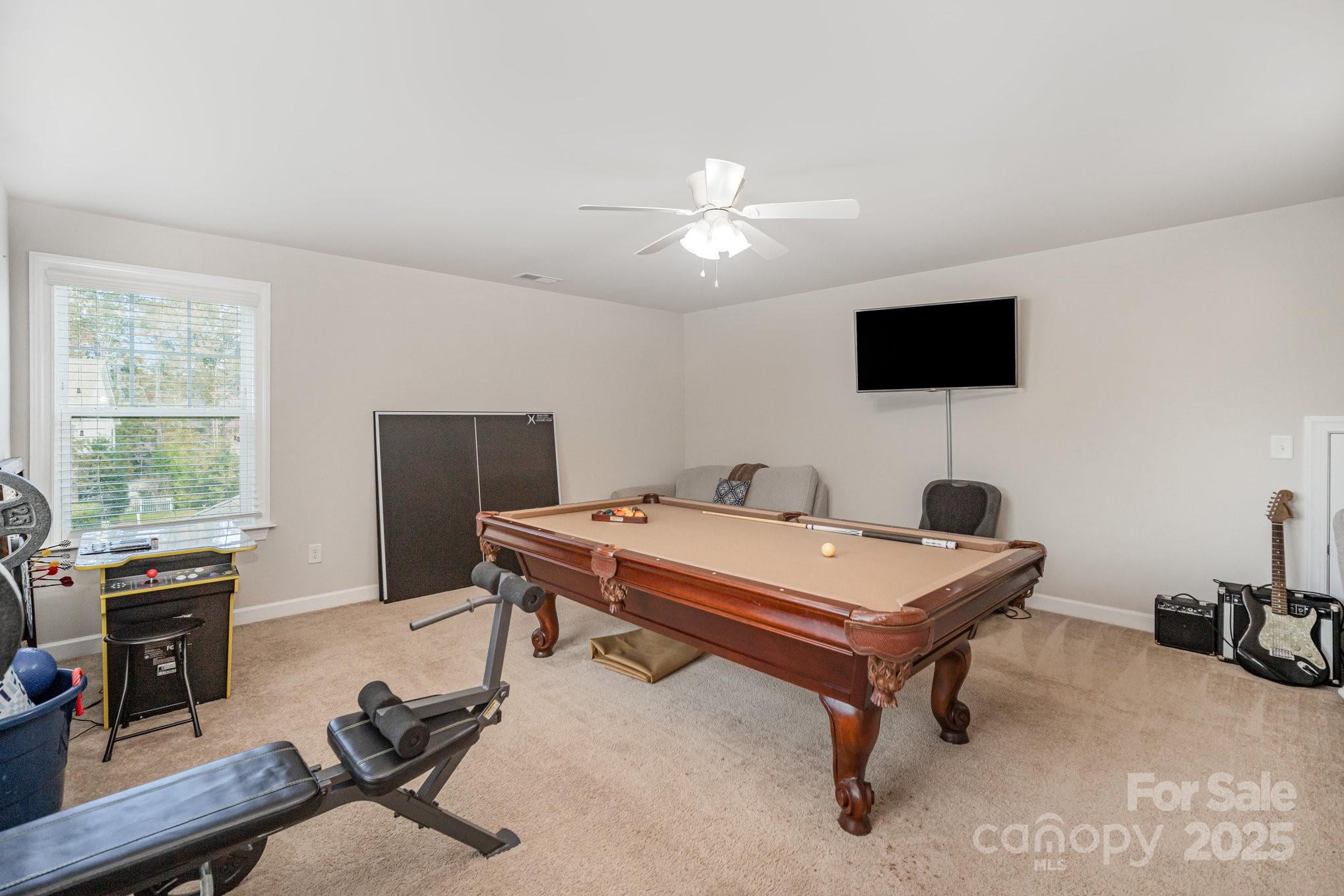 1556 Prickly Lane Waxhaw, NC 28173 - Photo 27 of 39 a room with furniture and a flat screen tv