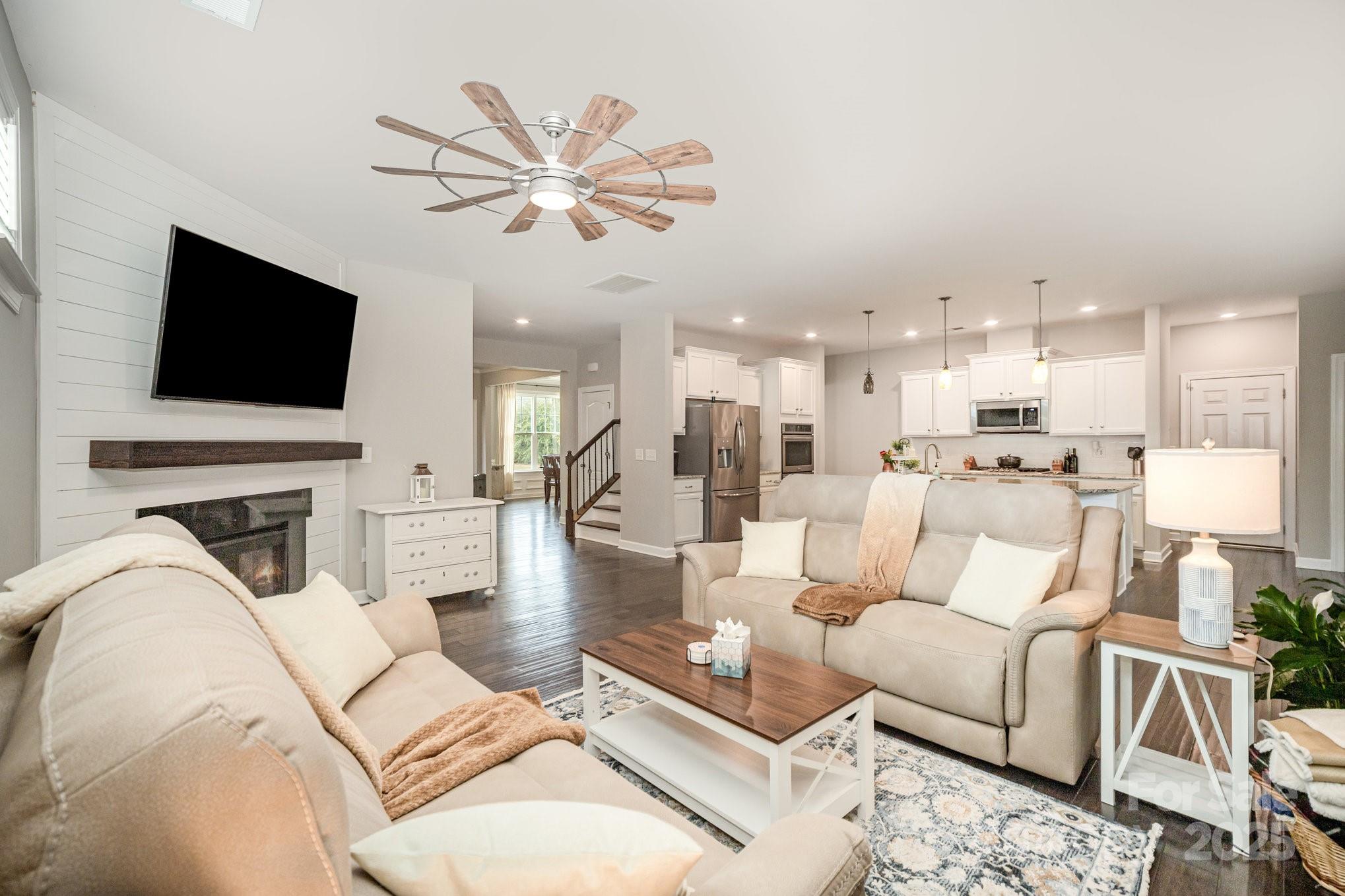 1556 Prickly Lane Waxhaw, NC 28173 - Photo 8 of 39 a living room with furniture and a flat screen tv