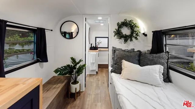 a view of living room with furniture and a potted plant