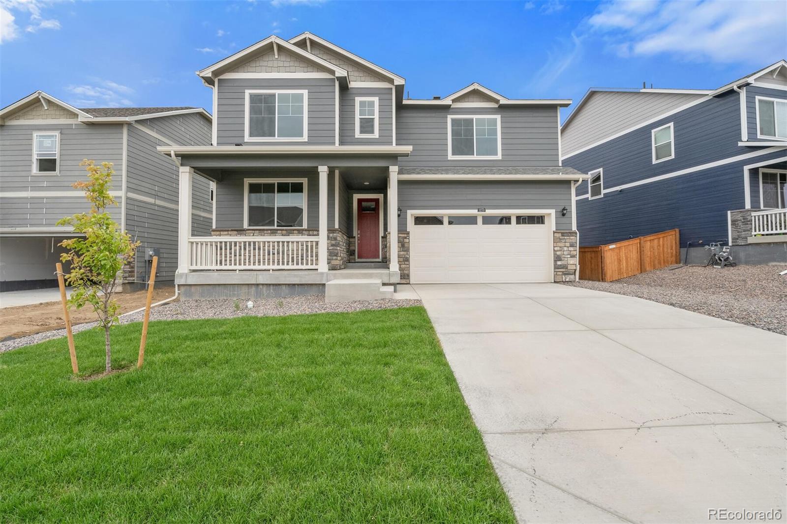 6020 Amerifax Drive Windsor, CO 80528 - Photo 1 of 16 a front view of a house with a yard