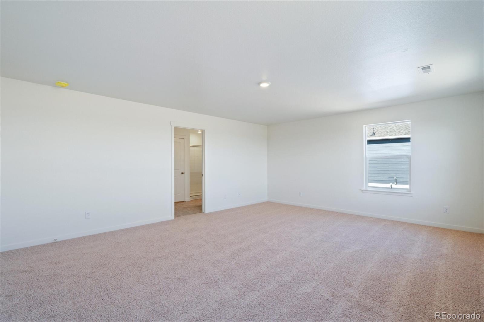 6020 Amerifax Drive Windsor, CO 80528 - Photo 12 of 16 a view of an empty room with a window