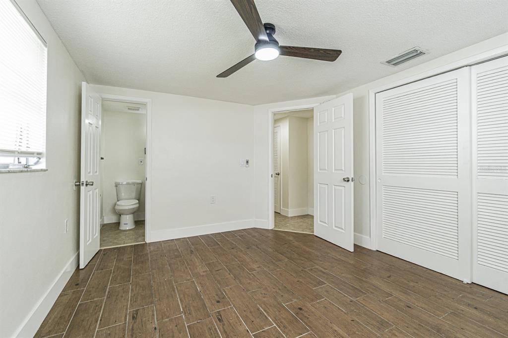 5631 Riddle Road Holiday, FL 34690 - Photo 15 of 27 a view of an empty room with wooden floor