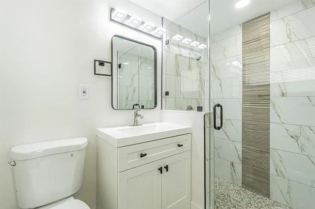 a bathroom with a sink and a shower