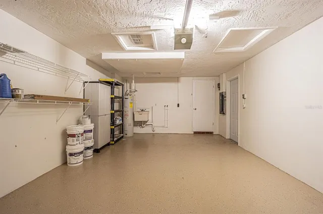 an aerial view of a house with a lake view