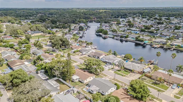 an aerial view of a house with a lake view